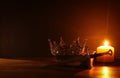 low key image of beautiful queen/king crown and sword. fantasy medieval period. Selective focus. Royalty Free Stock Photo