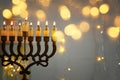 Low key image of jewish holiday Hanukkah background with menorah & x28;traditional candelabra& x29; Royalty Free Stock Photo