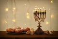 Low key image of jewish holiday Hanukkah background with traditional spinnig top, menorah & x28;traditional candelabra& x29; Royalty Free Stock Photo