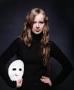 Low key portrait of a beautiful girl with mask Royalty Free Stock Photo