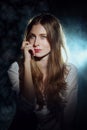 Portrait in mist of dreamy girl in white shirt and jeans with long curly hair Royalty Free Stock Photo