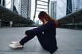 Low key portrait of stressed frustrated young Asian business woman sitting and feeling tired or disappointment Royalty Free Stock Photo