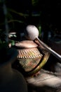 Low key scene of close focus on vintage and old pottery water jar in outdoor