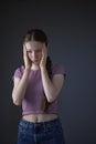 Low Key Studio Portrait Of Stressed Teenage Girl Worried About Mental Health Issues Or Bullying Royalty Free Stock Photo