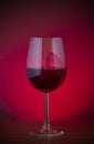 Low key vignette image of red wine