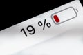 Smartphone battery level indicator - nineteen, 19 percent: close up macro