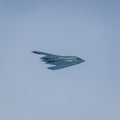 Low-level USAF B2 stealth bomber in a right bank exposing the top of the aircraft