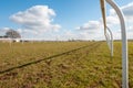 Low level view along an empty horse racing course on a bright and sunny day