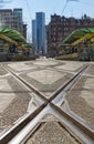 Low level view of tram lines, leading to tram stop. St Peter`s Square, Manchester Royalty Free Stock Photo