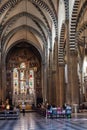 Florence ITALY - August 6, 2023 - Low light central nave with stained glass windows in Santa Maria Novella church