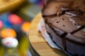 Low light photo some pieces of fresh pie in confectionery fridge on blurred background. Close-up view