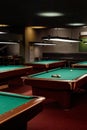 Low Lit Pool Club with Several Billiard Tables Royalty Free Stock Photo