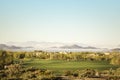 Low lying fog in below mountain peaks in distance Royalty Free Stock Photo