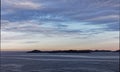 Low lying Islands silhouetted in the Early Morning Light on the Norwegian West Coast near to Bergen Royalty Free Stock Photo