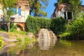 Low perspective view of small waterfall with pond near place called Ancient Ruins in the Arboretum Alexandria in Bila Tserkva