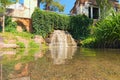 Low perspective view of small waterfall with pond near place called Ancient Ruins in the Arboretum Alexandria in Bila Tserkva