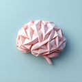 Low poly geometric brain in soft pink tones on pastel blue background, representing rigid cognition and neurodevelopmental Royalty Free Stock Photo