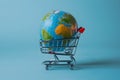 Low poly global depicted on white background within shopping cart