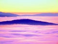 Low poly. Misty awakening in a beautiful hills. Peaks of hills are sticking out from fog