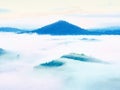 Low poly. Misty awakening in a beautiful hills. Peaks of hills are sticking out from fog