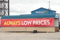 tor, canada - august 18, 2023: always low prices sign banner on side of corral cover in walmart supercentre 53 p 20