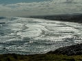 Waves coming ashore, Muriwai Beach, Auckland, New Zealand Royalty Free Stock Photo