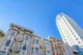 Low-rise apartment buildings beside the high-rise building in a low angle view at San Francisco, CA