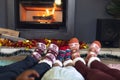 Low section of african american family wearing socks and sitting in living room Royalty Free Stock Photo