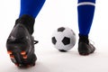 Low section of biracial young female player playing soccer against white background