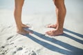 Low section of couple standing on shore Royalty Free Stock Photo