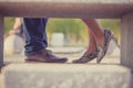 Low section, cropped image couple standing in stylish shoes in a park , close to each other