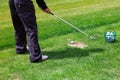 Low section of golf player ready to hit the ball Royalty Free Stock Photo