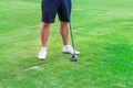 Low section of golf player ready to hit the ball Royalty Free Stock Photo
