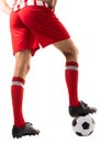 Low section of male caucasian athlete stepping on soccer ball over white background Royalty Free Stock Photo