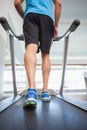 Low section of a man running on treadmill Royalty Free Stock Photo