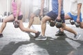 Low section of people lifting kettlebells at crossfit gym