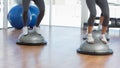 Low section of people performing step aerobics exercise Royalty Free Stock Photo