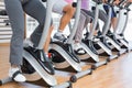 Low section of people working out at spinning class Royalty Free Stock Photo