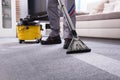Person Cleaning Carpet With Vacuum Cleaner Royalty Free Stock Photo