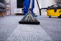 Person Cleaning Carpet With Vacuum Cleaner Royalty Free Stock Photo