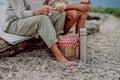 Low section of senior couple enjoying picnic outdoor near sea. Royalty Free Stock Photo