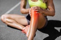 Low section of sportswoman suffering from joint pain Royalty Free Stock Photo