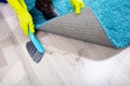 Janitor Sweeping Dirt Under The Carpet Royalty Free Stock Photo