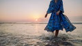 Low section of woman in orient dress enjoying sea. Royalty Free Stock Photo