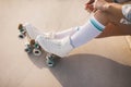 low section woman tying roller skate lace. High quality photo