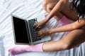 Low section of woman using laptop Royalty Free Stock Photo