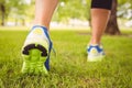 Low section of woman wearing shoes at park Royalty Free Stock Photo