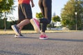 Low section of young couple running