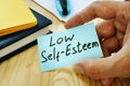 Low Self esteem sign in the hand Royalty Free Stock Photo