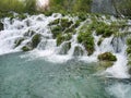 Low shutter speed of beautiful waterfalls, Plitvice lakes national park UNESCO, dramatic unusual scenic, green foliage alpine Royalty Free Stock Photo